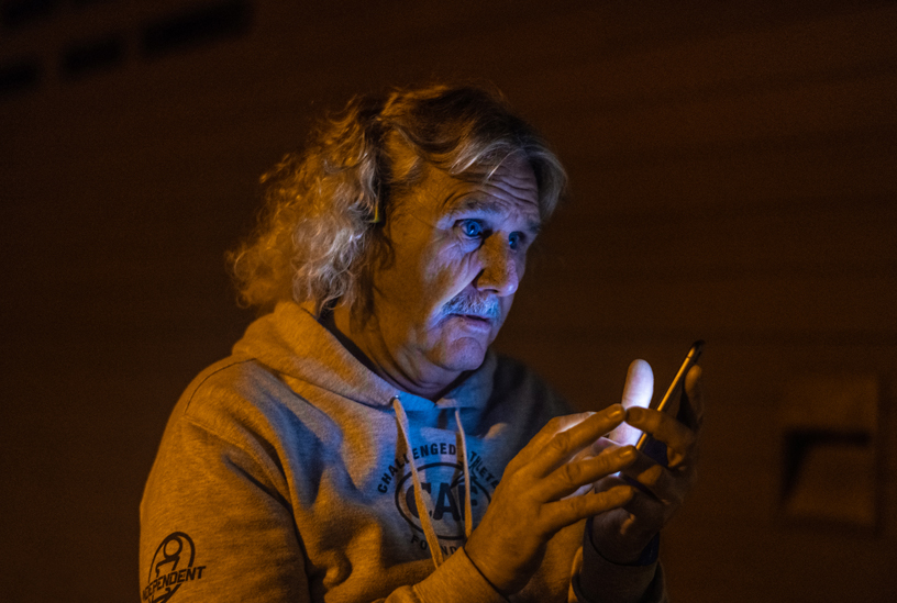 Leason checks his iPhone XR before the day’s session.