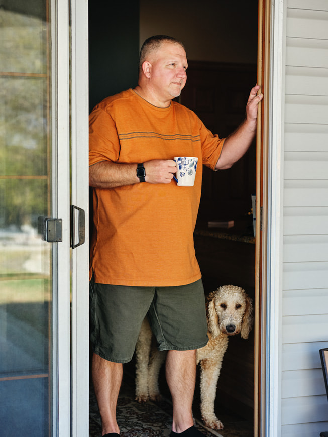 Robert Guithues is pictured at home drinking a cup of coffee.