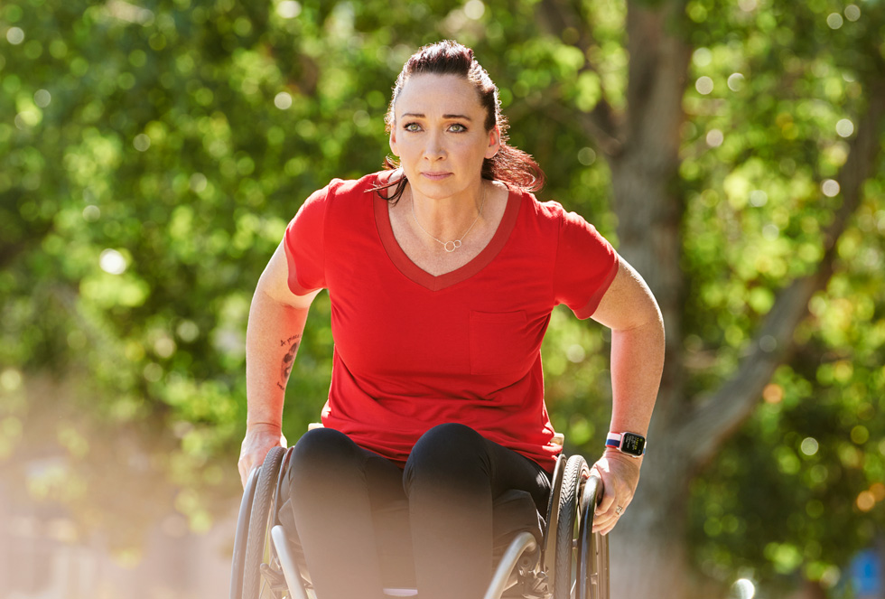 Amy Van Dyken rolling on her wheelchair.