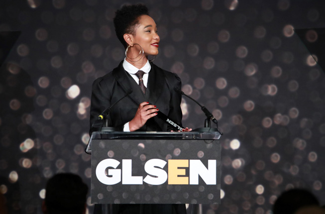 Elle Smith holds their GLSEN award trophy.