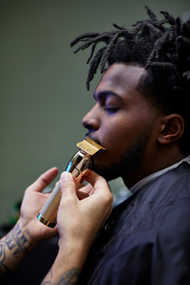 A young man getting a haircut.