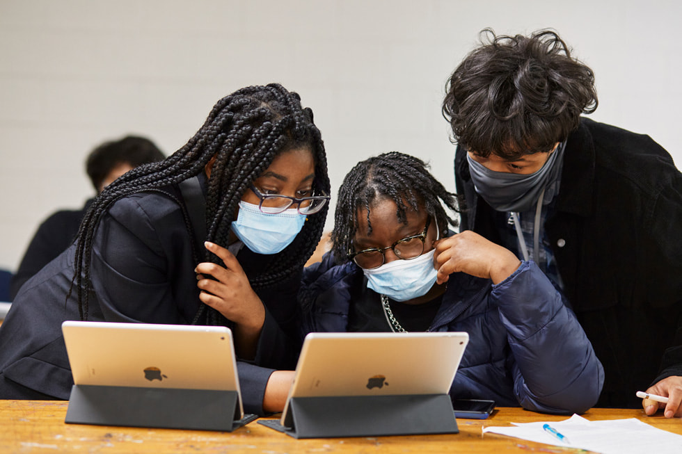 Boys & Girls Clubs of America students work on iPad in a classroom setting.