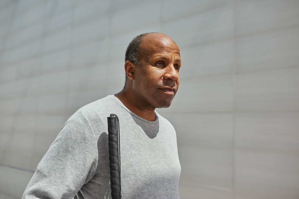 Dean Hudson with a white cane.