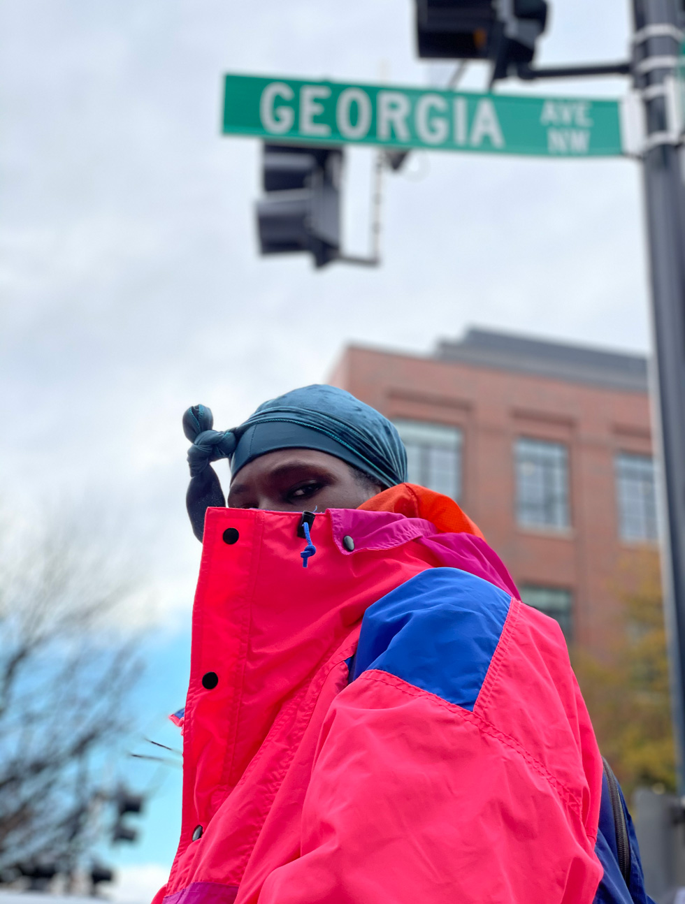 Nate, photographed beneath a Georgia Avenue street sign.