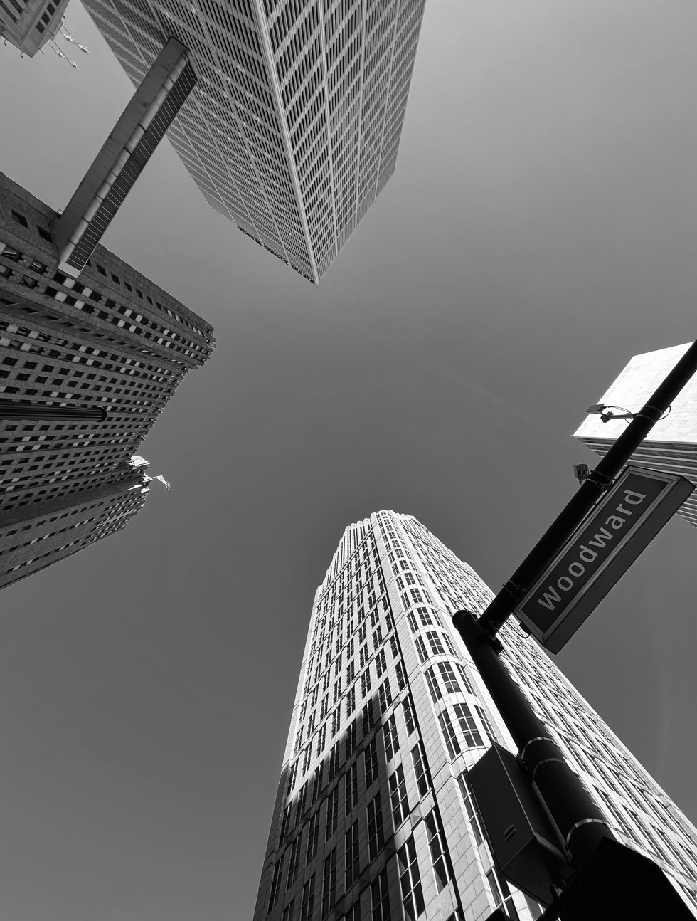 Woodward Avenue street sign and skyscrapers.