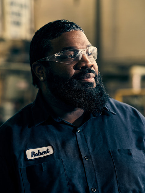 A Diversified Chemical Technologies, Inc. employee with safety goggles.