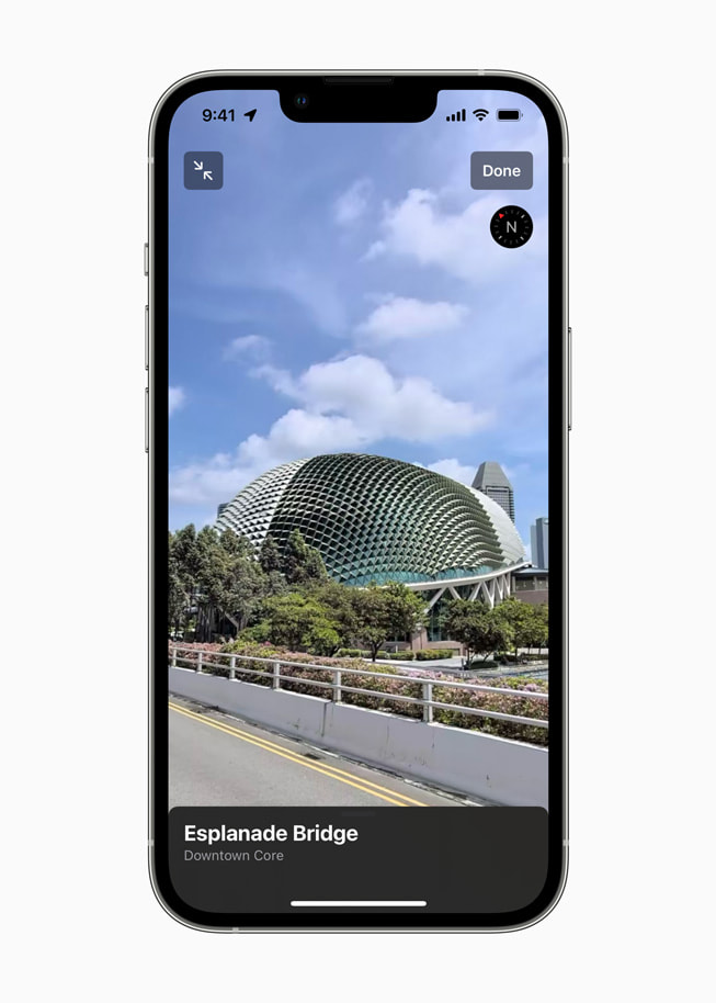 An iPhone screen shows Esplanade Drive in Singapore on Apple Maps.