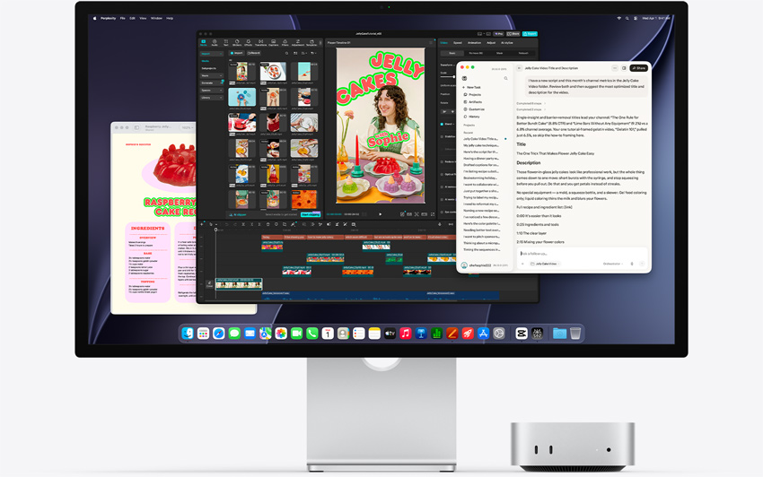 Widok z przodu na Maca mini wsuniętego pod monitor Studio Display. Na ekranie widać aplikacje Perplexity Personal Computer, CapCut i Pages działające w systemie macOS