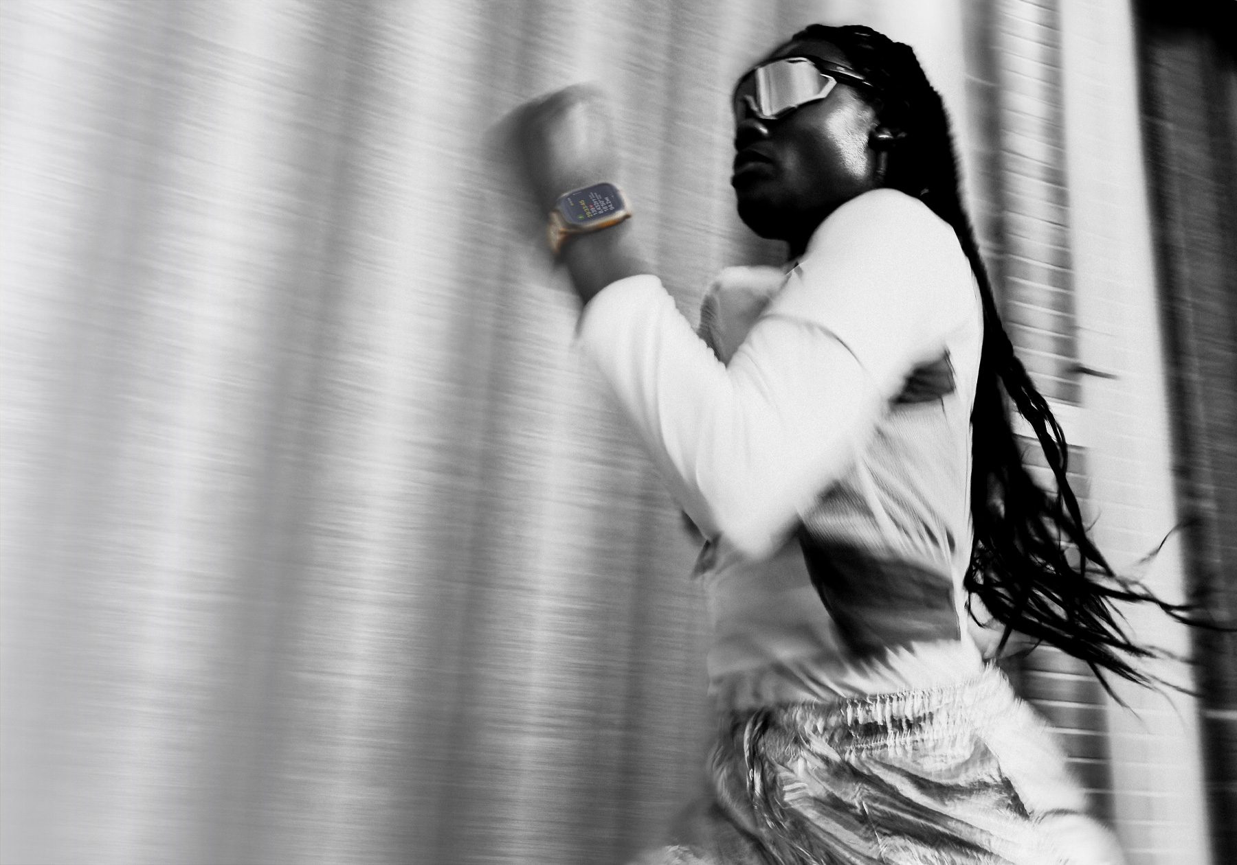 A person running while wearing Apple Watch Ultra 4
