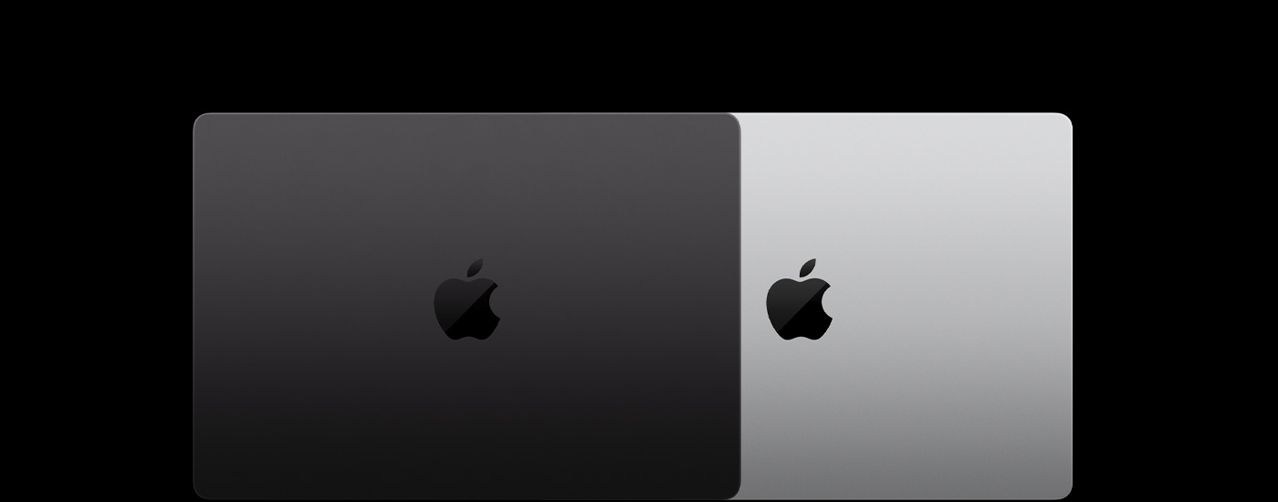 Vista desde arriba de dos portátiles Mac cerrados, uno encima del otro.