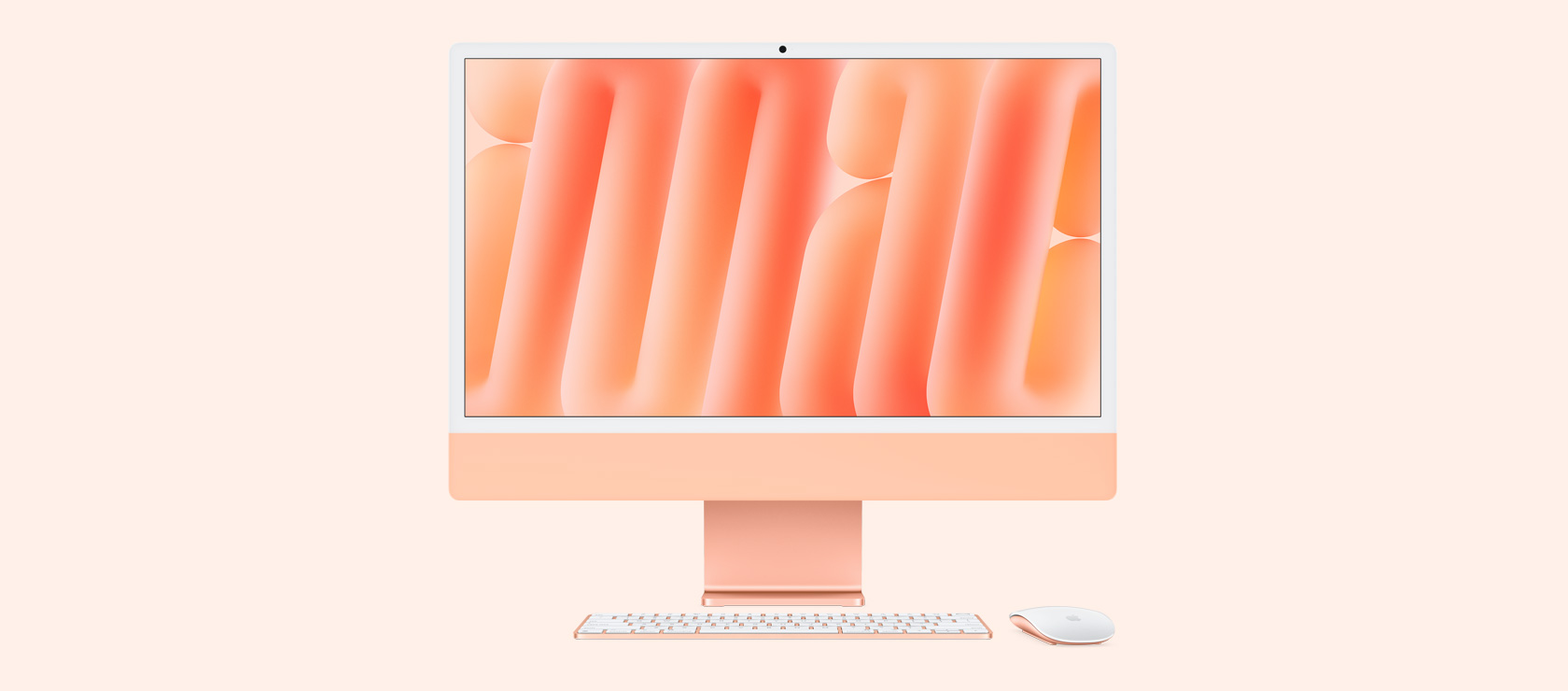 正面圖展示橙色 iMac 配上襯色的滑鼠和鍵盤