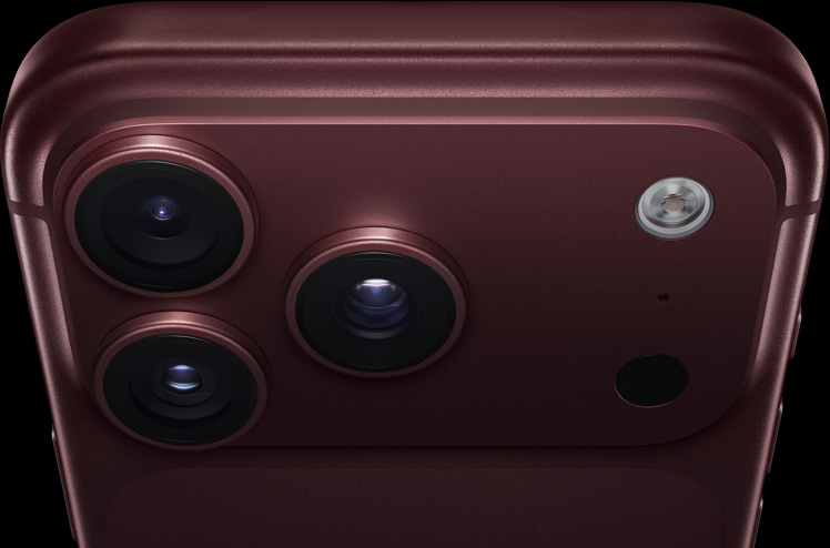 iPhone 18 Pro, burgundy finish, partial back exterior angled to show pro camera system in top left corner, 3 lenses, microphone, flash