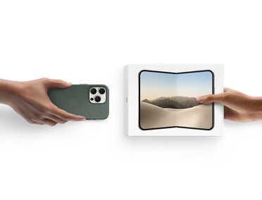 Hands exchanging trade-in iPhone 17 with Silicon cover for new iPhone Duo in the box