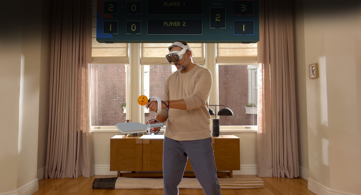 Man wearing Apple Vision Pro and Sony PlayStation VR2 Sense Controller playing: Pickle Pro game, a spatial scoreboard above his head