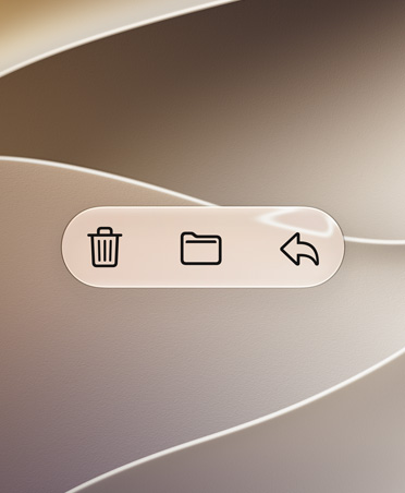 Botones de la app Mail, como Eliminar, Transferir y Responder, sobre un fondo ondulante dorado, el alto contraste hace que destaquen