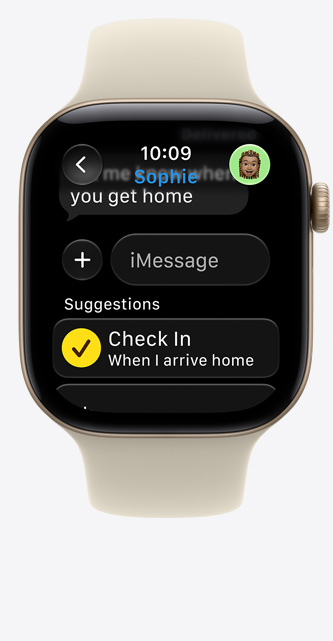 Apple Watch Series 12, screen shows Check In suggestion in iMessage, aluminum case, light gold color, connected to Sport Band, sand color (pale tan)